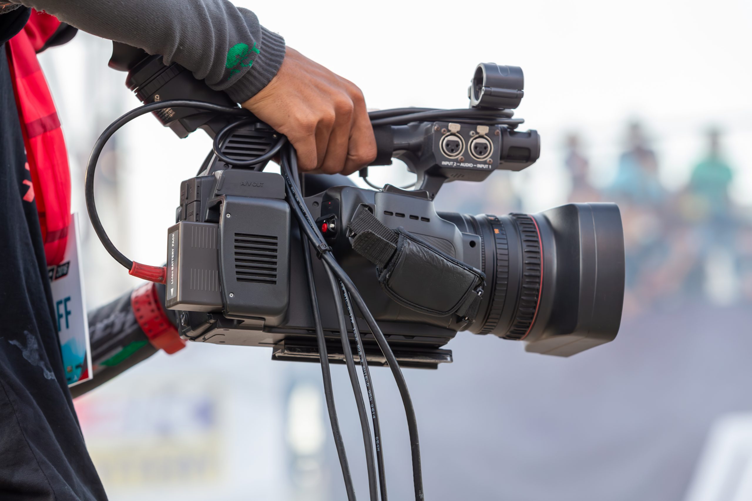 videographer holding video camera